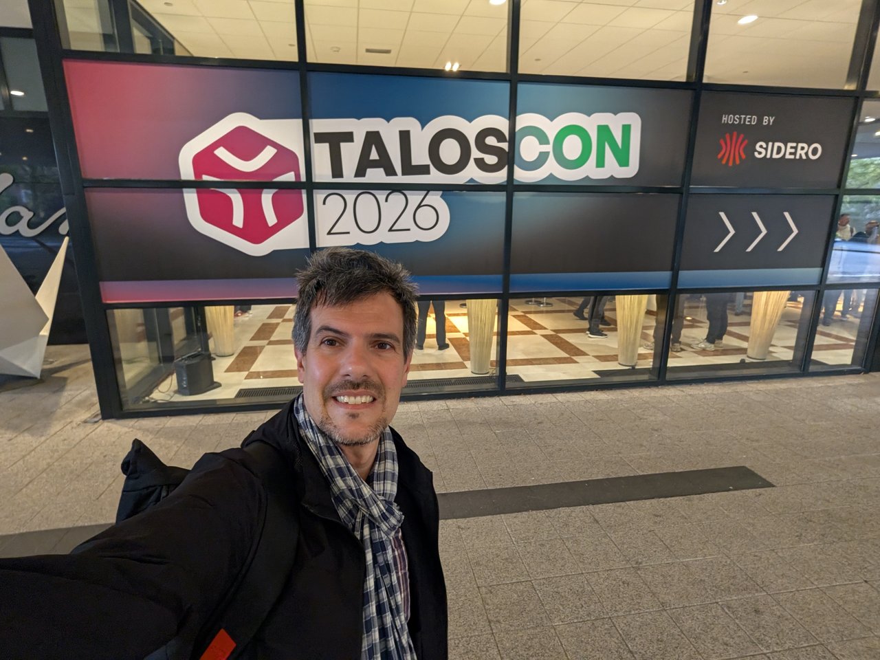 Luca Berton at the TalosCon 2026 entrance sign at Hotel Okura Amsterdam